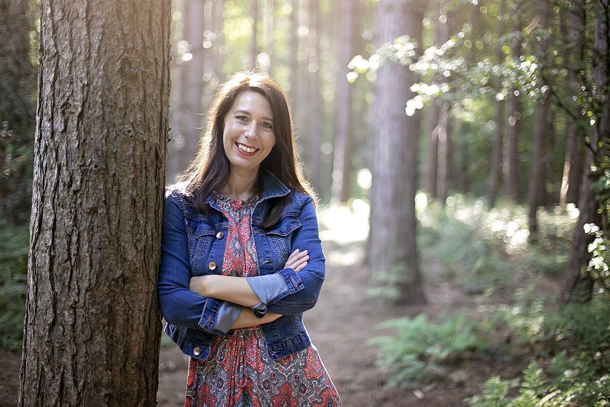 woman smiling in forest