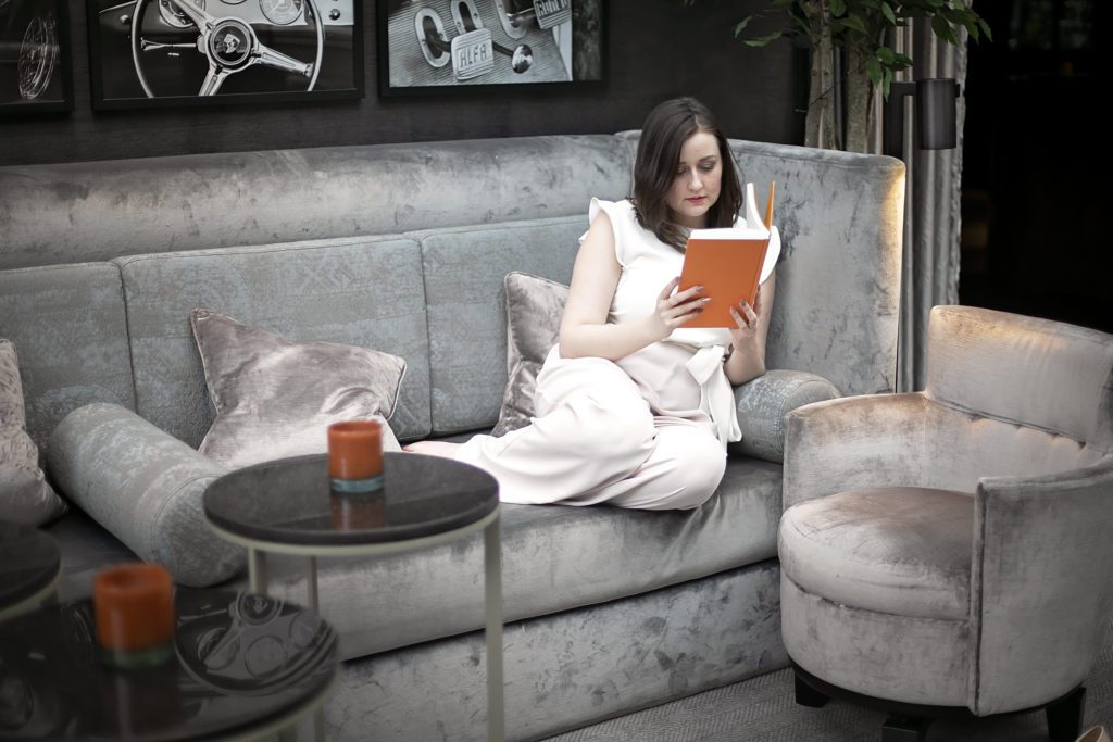 woman reading book in Dakota Leeds