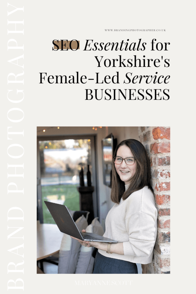 SEO essentials from Katie McHugh stood against a wall with her laptop